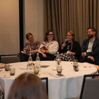 Panelists at the Showcase speaking